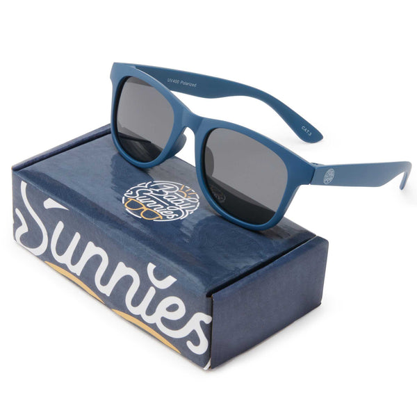 Navy blue kids polarized sunglasses with flexible frame for ages 3-8 on branded box.