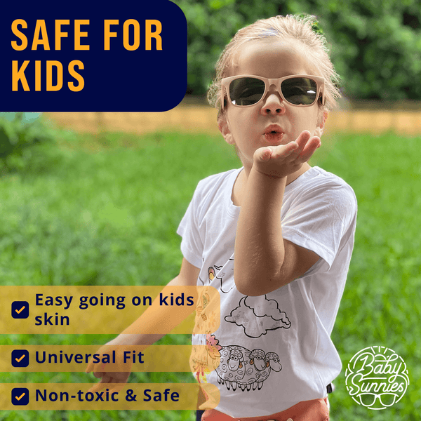 Kids wearing polarized pink sunglasses outdoors, safe and eco-friendly.