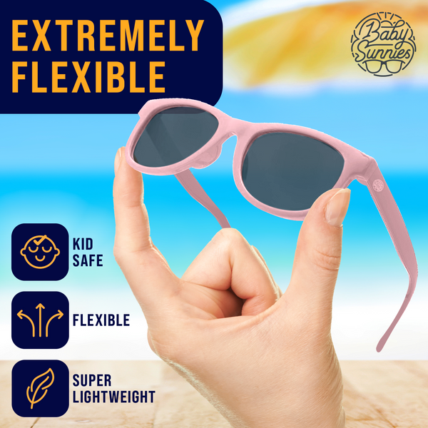 Pink polarized baby sunglasses with strap, flexible and lightweight, UV400 protection, eco-friendly design for ages 0-24 months.